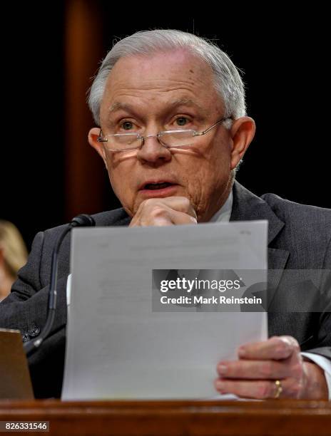 Attorney General Jeff Sessions reads from a document as testifies before the Senate Intelligence Committee, Washington DC, June 13, 2017.