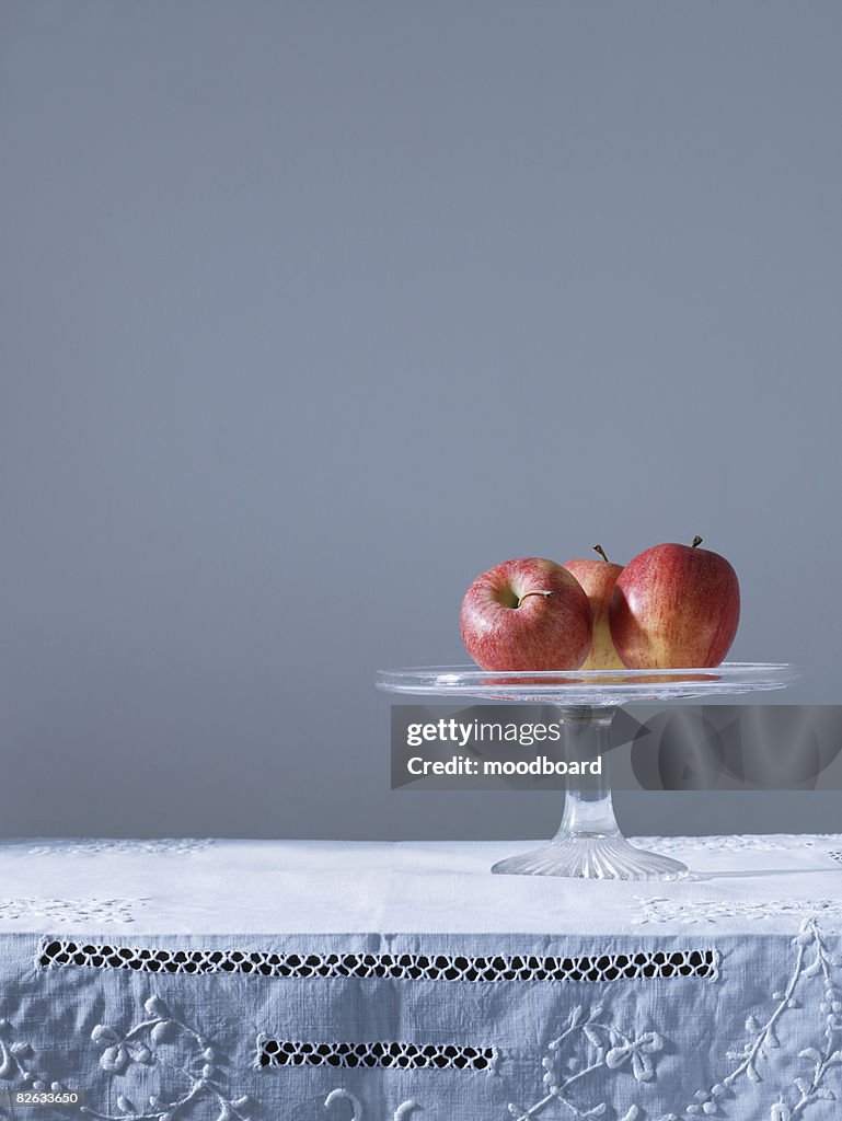 Three apples on fruit platter on table