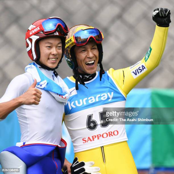 Noriaki Kasai celerbates after winning he men's event with second place Ryoyu Kobayashi during the Miyanomori Sumemr Ski Jumping Championships at...