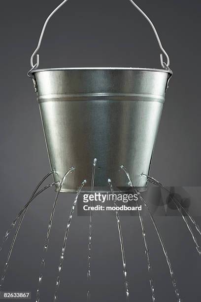 water leaking from bucket - bucket stock-fotos und bilder