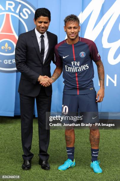 Neymar is unveiled alongside Paris Saint Germain president Nasser Al-Khelaifi during a press conference at the Parc des Princes, following his world...