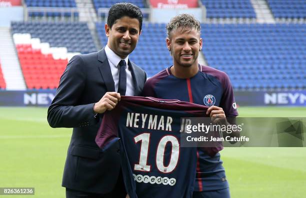 Neymar Jr of Brazil - here with President of PSG Nasser Al-Khelaifi - during press conference and jersey presentation following his signing as new...
