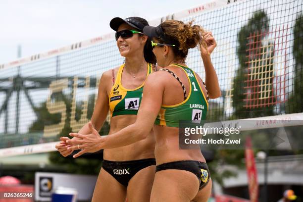 Talita Da Rocha Antunes and Larissa Franca Maestrini of Brazil celebrate during Day 8 of the FIVB Beach Volleyball World Championships 2017 during...