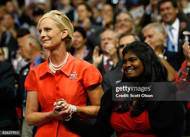 Cindy McCain , wife of presumptive Republican presidential nominee U.S. Sen. John McCain , and their daughter Bridget hold hands on day two of the...