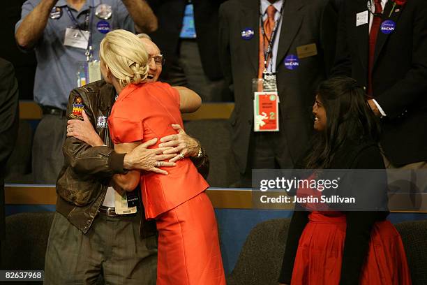 Bud Day, retired U.S. Air Force Colonel and POW cellmate, hugs Cindy McCain Cindy McCain , wife of presumptive Republican presidential nominee U.S....