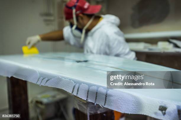 Milano, Italy. Antonio Aguirre, surf boards shaper, chases the summer living between Italy and Perù.