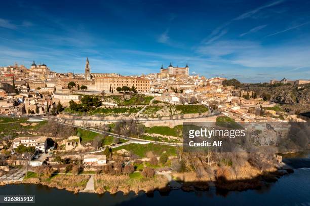 panoramic view of the imperial city of toledo, spain - alcázar stock-fotos und bilder