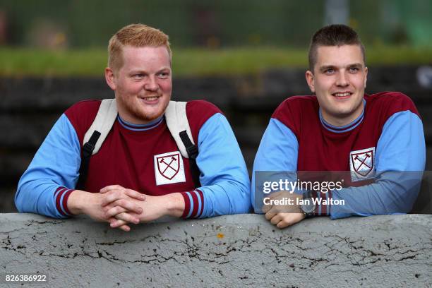 Two West Ham United fans look on during a Pre Season Friendly between Manchester City and West Ham United at the Laugardalsvollur stadium on August...