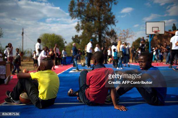 Children sit during a basketball clinic practice with NBA players from various countries on the eve of the NBA Africa Game 2017 basketball match...