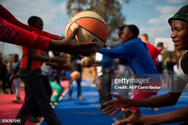 Children take part in a basketball clinic practice with NBA players from various countries on the eve of the NBA Africa Game 2017 basketball match...