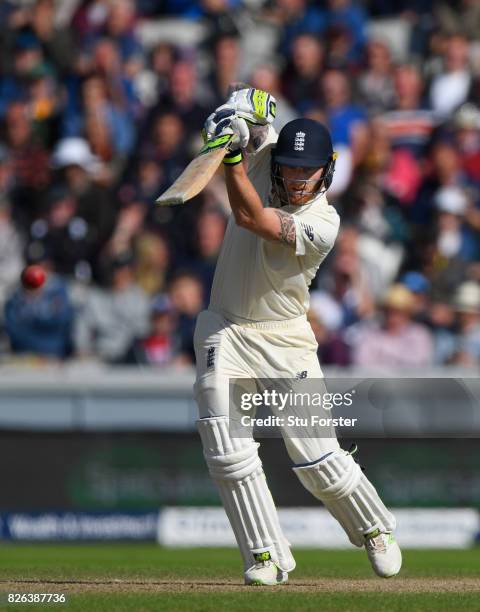 England batsman Ben Stokes drives a ball to the boundary during day one of the 4th Investec Test match between England and South Africa at Old...