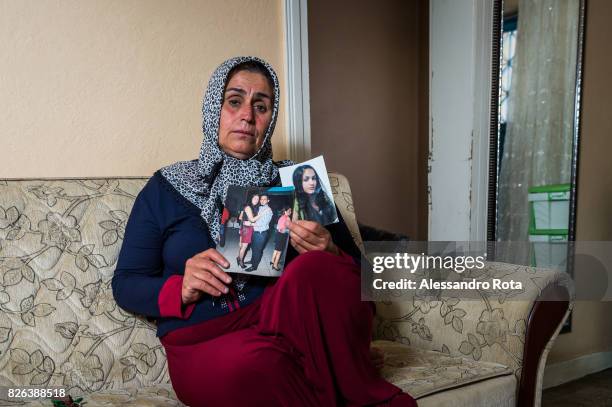 June 2015 - Ergani, Turkey. Hanim Kaya mother of Mutlu Kaya poses for a portrait in the house where Mutlu was shot in the head on the night of the...