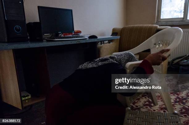 June 2015 - Ergani, Turkey. Hanim Kaya mother of Mutlu Kaya remembers moments of joy with her daughter in the house where Mutlu was shot in the head...