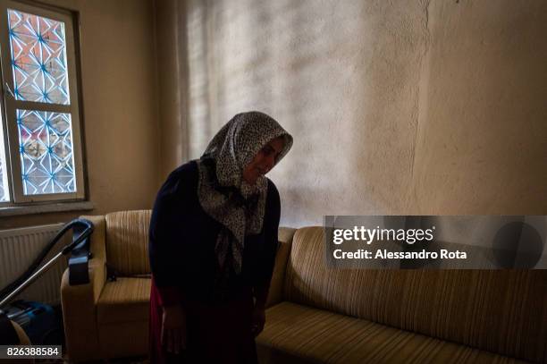 June 2015 - Ergani, Turkey. Hanim Kaya mother of Mutlu Kaya remembers moments of joy with her daughter in the house where Mutlu was shot in the head...