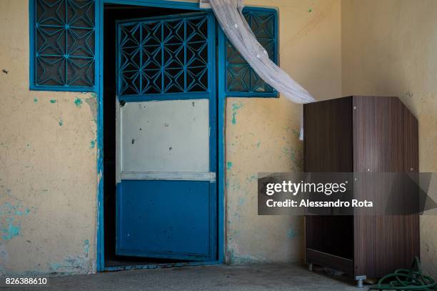 June 2015 - Ergani, Turkey. Entrance door of the house of the Kaya"u2019s family. Mutlu Kaya was shot in the head on the night of the 17th of May...