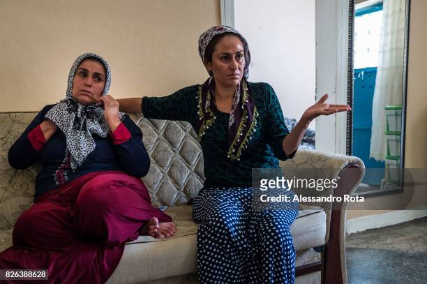June 2015 - Ergani, Turkey. Hanim Kaya mother of Mutlu Kaya remembers moments of joy with her older daughter Sevil Denizhan in the house where Mutlu...