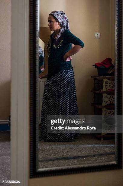 June 2015 - Ergani, Turkey. Sevil Denizhan sister of Mutlu Kaya remembers moments of joy with her younger sister in the house where Mutlu was shot in...