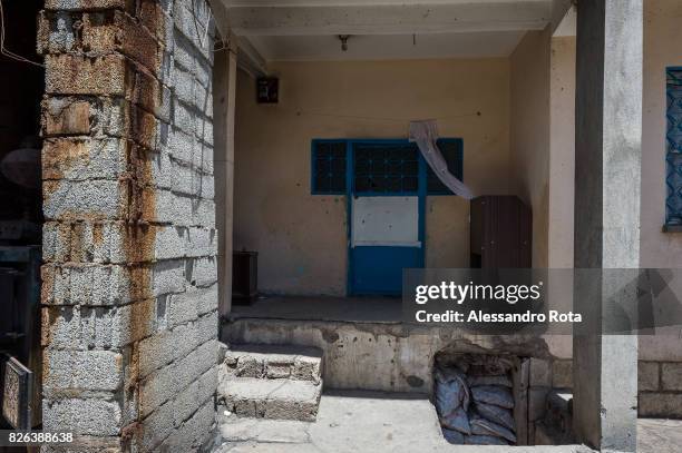 June 2015 - Ergani, Turkey. Entrance door of the house of the Kaya"u2019s family. Mutlu Kaya was shot in the head on the night of the 17th of May...