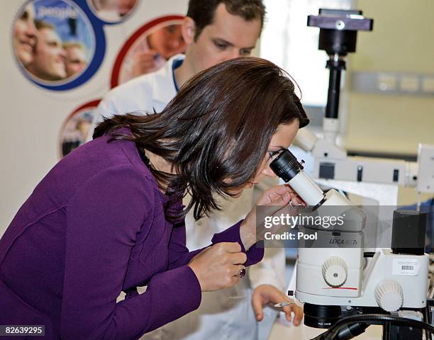 Her Royal Highnesses Princess Mary of Denmark looks through a microscope during a visit at the Victor Chang Research Center on September 3, 2008 in...