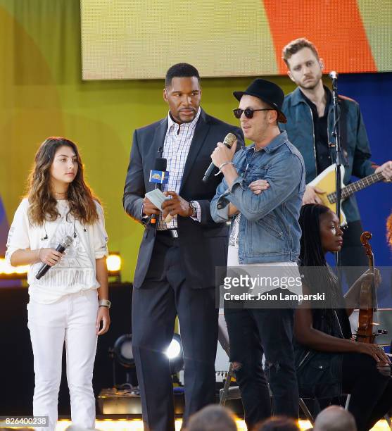 Anchor, Michael Strahan with Chris Cornell's doughter, Toni Cornell join Ryan Tedder of OneRepublic during a performance on ABC's "Good Morning...