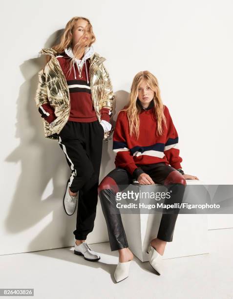 Models Tes Linnenkoper and Hanna Halvorsen pose at a fashion shoot for Madame Figaro on June 30, 2017 in Paris, France. Left: Coat , sweatshirt ,...