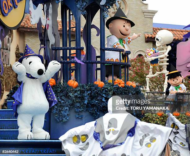 Snoopy , Charlie Brown and other Peanuts character wave to the audience from a special float during the press preview of the Halloween Character...