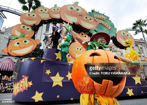 Sesame Street character Count von Count, often known as The Count , Bert and Big Bird wave to the audience from a special float during the press...