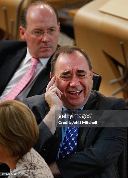 Alex Salmond, Scotland's First Minister, sits in the Scottish Parliament with deputy leader Nicola Sturgeon and finance secretary, John Swinney,...