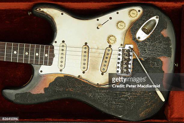 Jimi Hendrix's 1965 Fender Stratocaster guitar shows it's burn marks at the Idea Generation Gallery on September 3, 2008 in London. The gallery will...