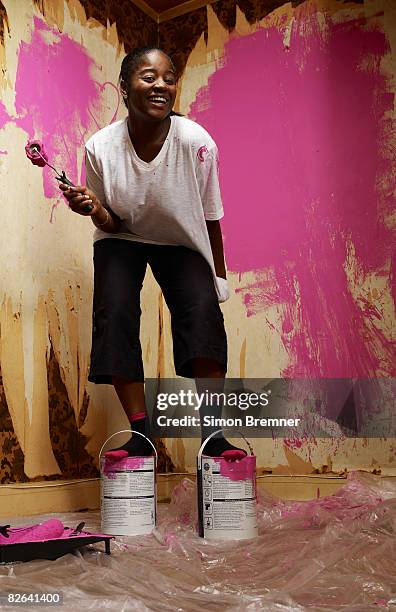 woman standing on paint cans - eccentric portrait stock pictures, royalty-free photos & images