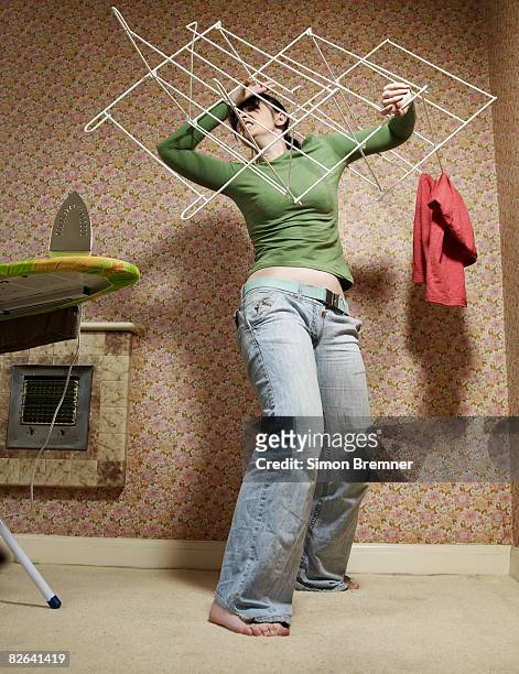 woman fighting with airer - iron stock pictures, royalty-free photos & images