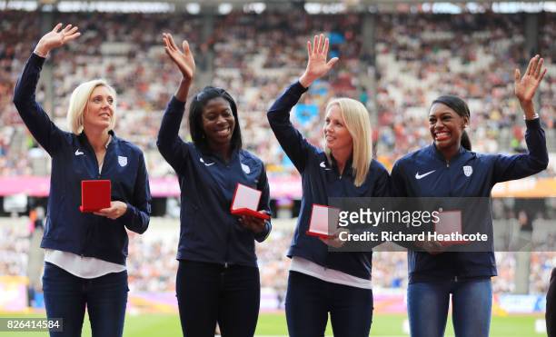 Perri Shakes Drayton, Nicola Sanders, Christine Ohuruogu and Lee McConnell of Great Britain recieve their reallocated bronze medals from the 4x400m...