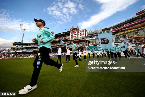 Surrey captain Gareth Batty leads his team onto the field ahead of the start of play during the NatWest T20 Blast match between Surrey and Glamorgan...