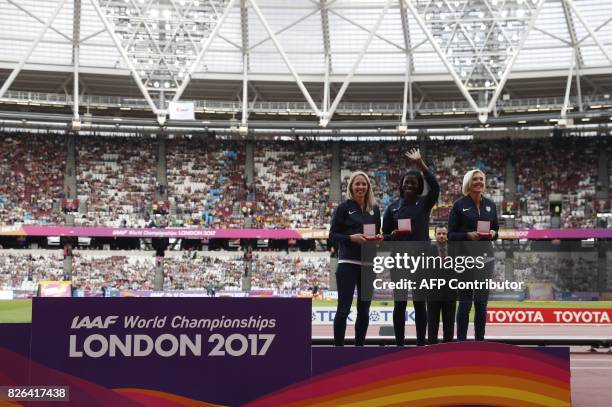 Britain's Nicola Sanders, Christine Ohuruogu and Lee McConnell pose on the podium with their bronze medals during the medal reallocation victory...