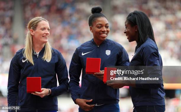 Ilidh Doyle, Margaret Adeoye and Christine Ohuruogu of Great Britain recieve their reallocated silver medals from the 4x400 womens relay at the 2013...