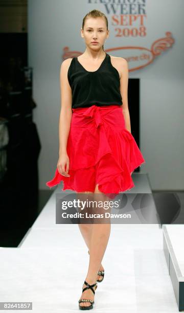 Model showcases designs by Therese Rawsthorne as part of the Out of The Shadows catwalk show on the second day of Melbourne Spring Fashion Week 2008,...