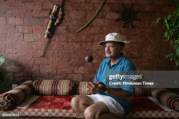 Ajit Wadekar tossing a season ball at his home in Worli.