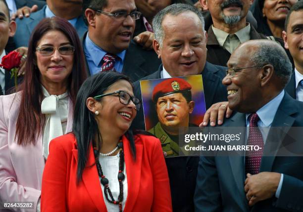 Members of the Constituent Assembly Cilia Flores, Delcy Rodriguez, Diosdado Cabello and Aristobulo Isturiz pose with a picture of late Venezuelan...