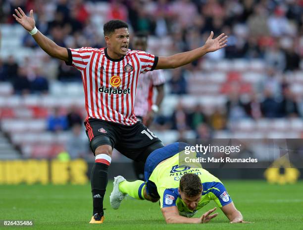 Chris Martin of Derby County is tackled by Tyias Browning of Sunderland during the Sky Bet Championship match between Sunderland and Derby County at...