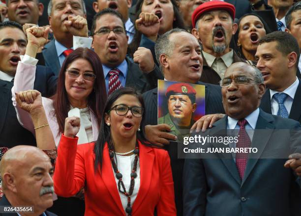 Members of the Constituent Assembly Cilia Flores, Delcy Rodriguez, Diosdado Cabello and Aristobulo Isturiz pose with a picture of late Venezuelan...