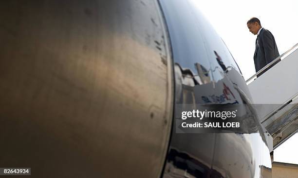 Democratic presidential candidate Illinois Senator Barack Obama disembarks from his campaign plane at Akron Canton Airport in North Canton, Ohio, on...