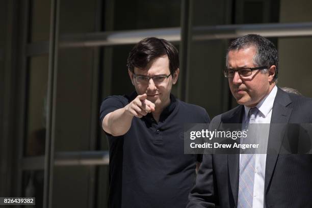 Former pharmaceutical executive Martin Shkreli points as he exits the courthouse after the jury issued a verdict in his case at the U.S. District...