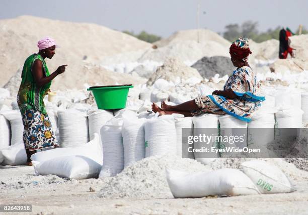 Woman sits on a bag of salt on rhe beach of Retba-Lake where locals extract salt on December 27, 2007 near Dakar, Republic of Senegal. Dakar is the...