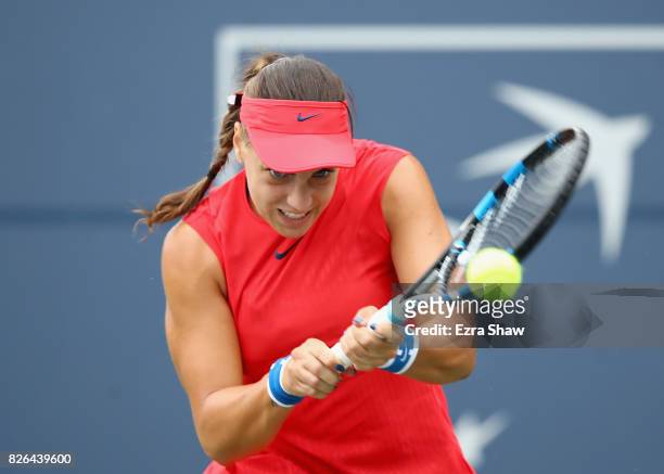Ana Konjuh of Croatia returns a shot to Garbine Muguruza of Spain during their quarterfinal match on Day 5 of the Bank of the West Classic at...