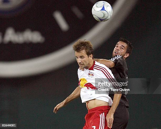 Joe Vide of D.C. United goes up for a header with Mike Magee of the New York Red Bulls during an MLS match at RFK Stadium on August 30 2008, in...