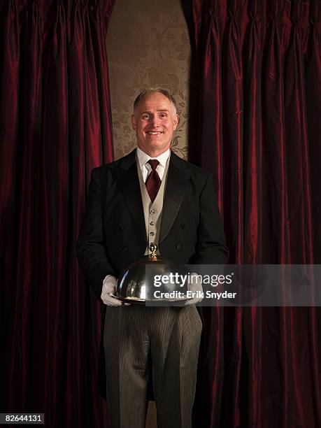 butler serving meal on silver serving tray. - cloche stock pictures, royalty-free photos & images