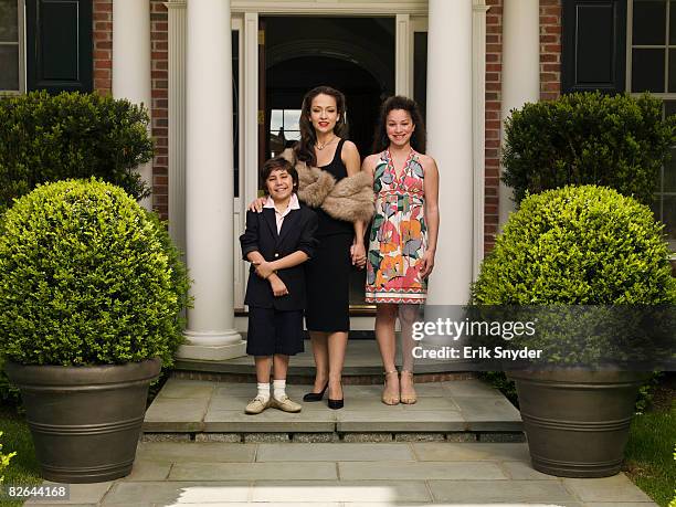 portrait on wealthy family at estate home. - boa mother stock pictures, royalty-free photos & images