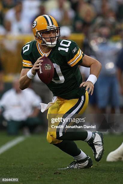 Matt Flynn of the Green Bay Packers rolls out to look for a receiver against the Tennessee Titans on August 28, 2008 at Lambeau Field in Green Bay,...