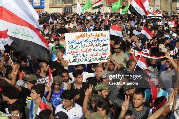 Supporters of Iraqi Shiite cleric Moqtada al-Sadr attend a demonstration against the new electoral bill of the country, prepared for the upcoming...