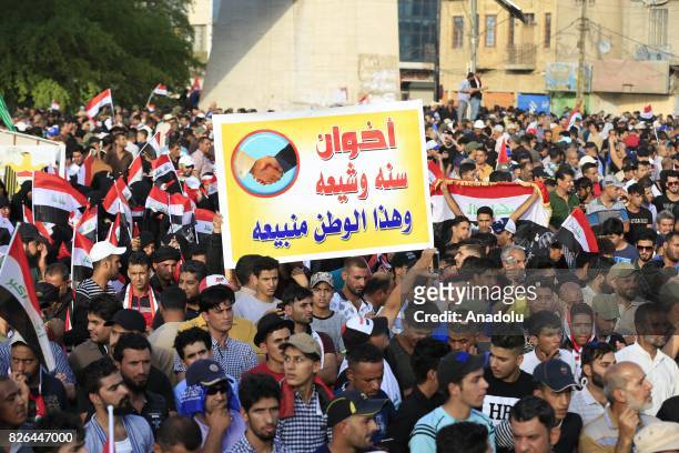 Supporters of Iraqi Shiite cleric Moqtada al-Sadr attend a demonstration against the new electoral bill of the country, prepared for the upcoming...